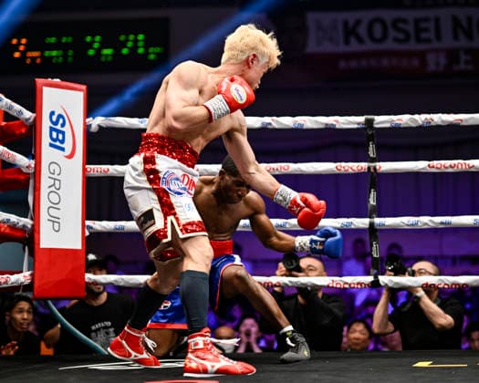 Hayato Tsutsumi (red gloves) of Japan knocks down Felix Batista (blue gloves) of Dominican Republic during their WBA Super Featherweight Title Eliminator boxing bout at Korakuen Hall in Tokyo, Japan, July 14, 2026. Noxthirdxpartyxsales  aflo_338074471 HIROAKIxFINITOxYAMAGUCHIx
