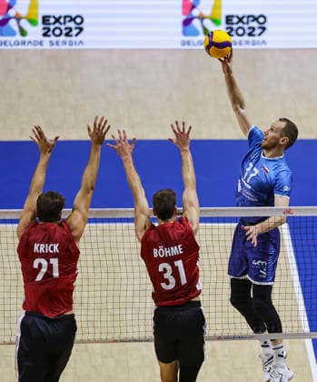 Men s Volleyball Nations League - Belgrade 2026 Slovenia s Tine Urnaut spikes the ball against Germany s Tobias Krick and Germany s Yann Bohme during the MenÕs Volleyball Nations League Pool 7 match between Germany and Slovenia at Belgrade Arena on July 15, 2026 in Belgrade, Serbia. Belgrade Serbia Copyright: xSrdjanxStevanovicx x