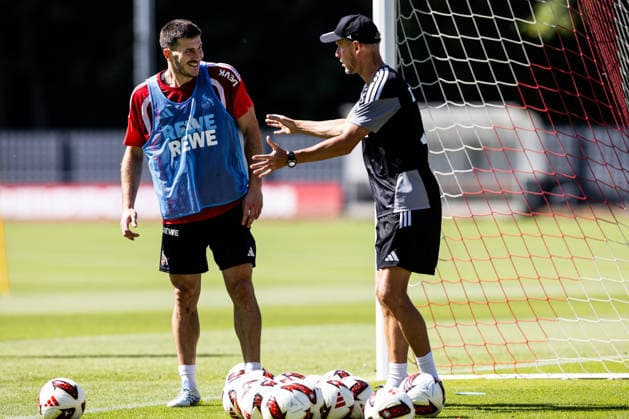 COLOGNE, GERMANY - JULY 15: Luka Lochoshvili (1. FC Koeln, 24) and Kevin McKenna (Assistant Coach 1. FC Koeln) talking during a training session of season 2026 27 at Geissbockheim on July 15, 2026 in Cologne, Germany. North Rhine Westphalia Germany Copyright: xSteffiexWunderlx