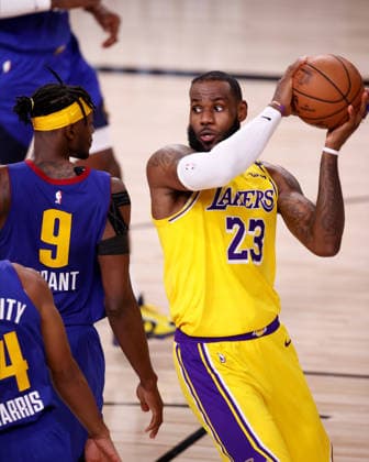 USA BASKETBALL NBA, Basketball Herren, USA PLAYOFFS Denver Nuggets at Los Angeles Lakers epa08680042 Los Angeles Lakers forward LeBron James (R) in action against Denver Nuggets forward Jerami Grant (L) during the second half of the NBA basketball Western Conference finals playoff game one between the Denver Nuggets and the Los Angeles Lakers at the ESPN Wide World of Sports Complex in Kissimmee, Florida, USA, 18 September 2020. Kissimmee United States  Copyright: xERIKxS.xLESSERx