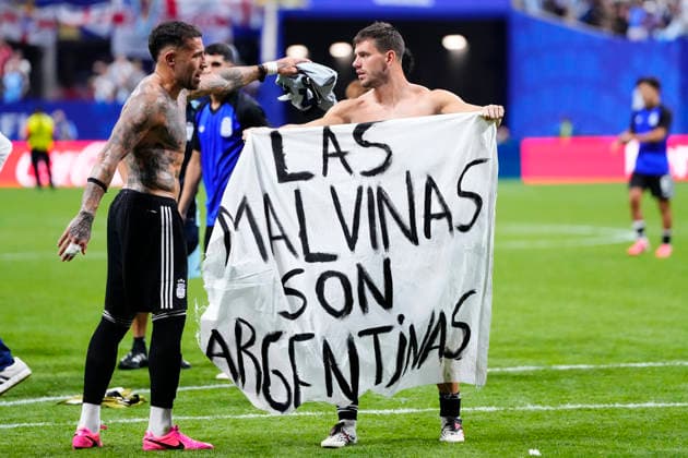 Football, 2026 FIFA World Cup, England v Argentina, Argentinians celebrate victory with a Falkland Islands banner
