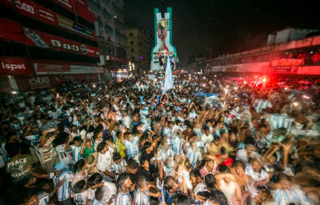 July 16, 2026, Dhaka, Munshiganj, Bangladesh: Thousands of football fans gathered at Super Market Chottor in Munshiganj, Dhaka, Bangladesh, on Tuesday night to watch the FIFA World Cup, WM, Weltmeisterschaft, Fussball 2026 semi-final between Argentina and England on giant screens. The public viewing attracted a large crowd as supporters followed one of the tournament s most anticipated matches. Argentina secured a dramatic 2Ã¢â‚¬1 victory with two late goals to book their place in the FIFA World Cup Final, while England s campaign came to an end after a spirited performance. The photographs capture the excitement, tension and emotions of football fans in Bangladesh as they witnessed Argentina s memorable comeback and qualification for the final. Bangladesh Football Fans Watch Argentina Defeat England To Reach The FIFA World Cup 2026 Final  - ZUMAa259 0861759591st Copyright: xRayhanxAhmedx