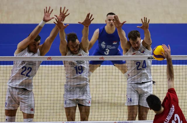 Men s Volleyball Nations League - Belgrade 2026 Turkey s Adis Lagumdzija spikes the ball against Serbia s Veljko Masulovic (L) Serbia s Aleksandar Stefanovic and Serbia s Vuk Kulpinac during the MenÕs Volleyball Nations League Pool 7 match between Serbia and Turkiye at Belgrade Arena on July 15, 2026 in Belgrade, Serbia. Belgrade Serbia Copyright: xSrdjanxStevanovicx x