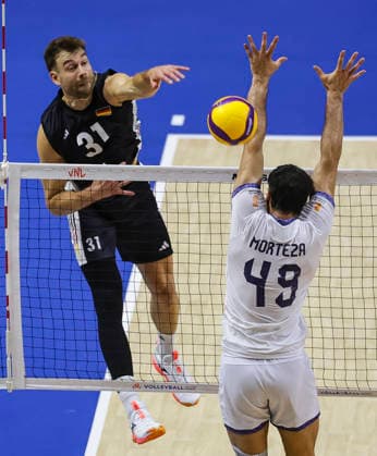 WomenÕs Volleyball Nations League - Belgrade 2026 Germany s Yann Bohme spikes the ball against IranÕs Morteza Sharifi during the MenÕs Volleyball Nations League Pool 7 match between Germany and Iran at Belgrade Arena on July 16, 2026 in Belgrade, Serbia. Belgrade Serbia Copyright: xSrdjanxStevanovicx x