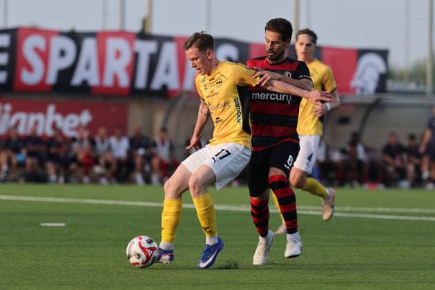 Petur Knudsen (left) of Runavik is challenged by Matthew Guillaumier of Hamrun Spartans during the UEFA Conference League First Qualifying Round, 2nd Leg match between Hamrun Spartans and Runavik at Centenary Stadium, Ta Qali, Malta on 16 July, 2026. Hamrun Spartans v Runavik - UEFA Conference League First Qualifying Round 1st Leg