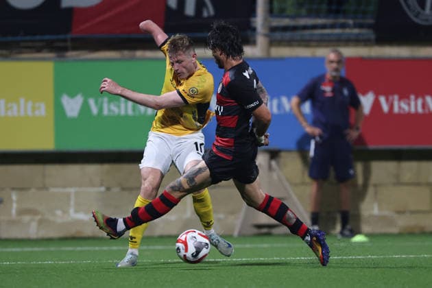 Marius Kryger Lindh (left) of Runavik is in action against Vincenzo Polito of Hamrun Spartans during the UEFA Conference League First Qualifying Round, 2nd Leg match between Hamrun Spartans and Runavik at Centenary Stadium, Ta Qali, Malta on 16 July, 2026. Hamrun Spartans v Runavik - UEFA Conference League First Qualifying Round 1st Leg