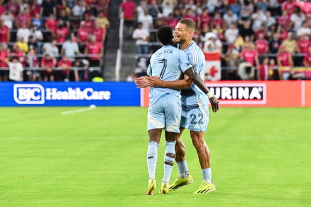ST. LOUIS, MO - JULY 16: Zorhan Bassong (22) of the Sporting Kansas City goes to hug Capita Capemba (7) of the Sporting Kansas City after his goal ties the game at two during the MLS, Fussball Herren, USA regular season match where St. Louis CITY SC hosted Sporting Kansas City on Thursday July 16th, 2026, at Energizer Park in St. Louis City, MO. (Photo by Rick Ulreich Icon Sportswire) SOCCER: JUL 16 MLS St. Louis CITY SC vs Sporting Kansas City EDITORIAL USE ONLY Icon26071619