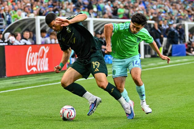 July 16, 2026: Portland Timbers Forward Kevin Kelsy (19) and Seattle Sounders Midfielder Paul Rothrock (14) copete for the ball during the first half of the MLS, Fussball Herren, USA match between Seattle Sounders FC and Portland Timbers FC in Seattle, WA. CSM MLS Soccer 2026: JUL 16 Seattle Sounders FC Vs Portland Timbers FC  - ZUMAc04_ 20260716_zma_c04_142 Copyright: xStevexFaberx