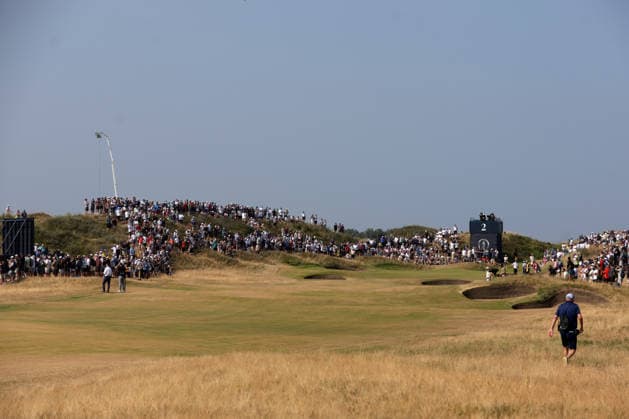 RECORD DATE NOT STATED 17th July 2026; Royal Birkdale Golf Club, Southport, Merseyside, England; The Open Championship Day Two; fans look on from the sand dunes surrounding the green at the 2nd hole DavidxBlunsden