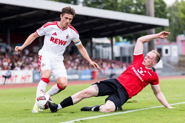 COLOGNE, GERMANY - JULY 18: Alessio Castro-Montes (1. FC Koeln, 17) controls the ball against Tom Krieg (FC Rheinsued Koeln, 16) during the first friendly game of season 2026 27 between 1. FC Koeln vs FC Rheinsued Koeln at Suedstadion on July 18, 2026 in Cologne, Germany. North Rhine Westphalia Germany Copyright: xSteffiexWunderlx