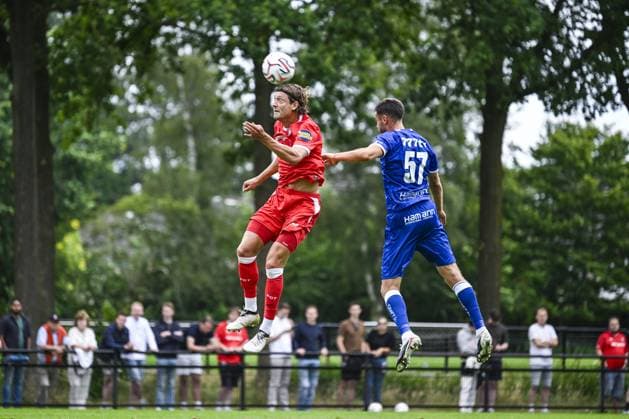 Twente s Sam Lammers and Gent s Matties Volckaert pictured in action during a friendly game between KAA Gent and Dutch FC Twente, at the summer training camp of Belgian first division soccer team KAA Gent in De Lutte, Losser, the Netherlands on Saturday 18 July 2026, to prepare for the upcoming 2026-2027 season. TOM GOYVAERTS TomxGoyvaerts  x181421282x