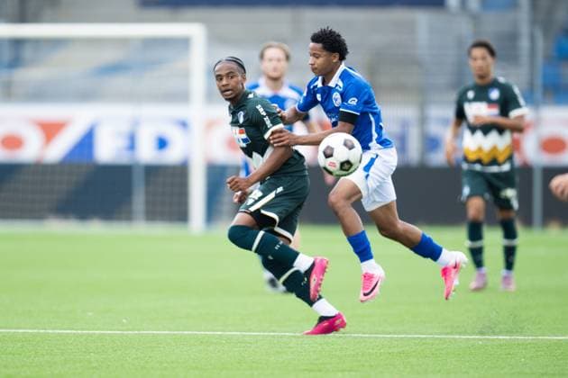 EINDHOVEN , 18-07-2026 , Jan Louwers Stadium , pre season 2026 2027 , Dutch Keukenkampioen divisie , football , match between FC Eindhoven and FC Den Bosch, picture shows FC Eindhoven player Tyrese Simons FC Den Bosch player Genrich Sille Eindhoven - Den Bosch (friendly)  x205090391x Copyright: