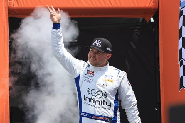 NORTH WILKESBORO, NC - JULY 18: Layne Riggs ( 34 Front Row Motorsports Infinite Communications Group Ford) waves to the fans prior to the running of the NASCAR, Motorsport, USA Craftsman Truck Series FaithFest 250 on July 18, 2026 at North Wilkesboro Speedway in North Wilkesboro, NC. (Photo by Jeff Robinson Icon Sportswire) AUTO: JUL 18 NASCAR CRAFTSMAN Truck Series Faith Fest 250 EDITORIAL USE ONLY Icon26071824548250