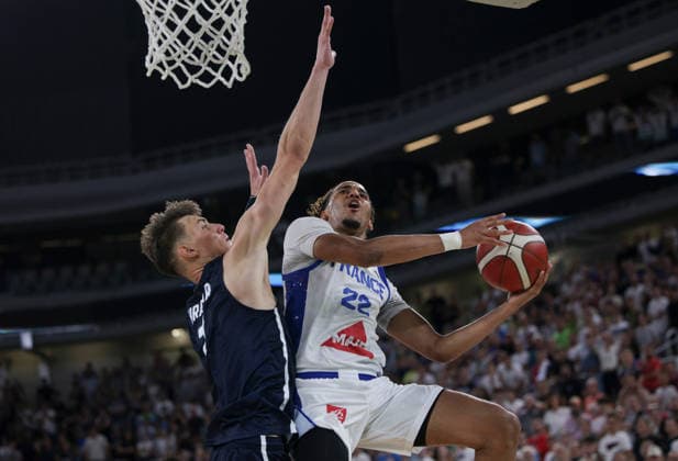 (260719) -- LJUBLJANA, July 19, 2026 -- Maidy Douglas (R) of France goes for a layup during the semifinal match between France and Slovenia at FIBA U20 EuroBasket 2026 in Ljubljana, Slovenia, July 18, 2026. (Photo by Xinhua) (SP)SLOVENIA-LJUBLJANA-BASKETBALL-FIBA U20 EUROBASKET-FRANCE VS SLOVENIA ZeljkoxStevanic 