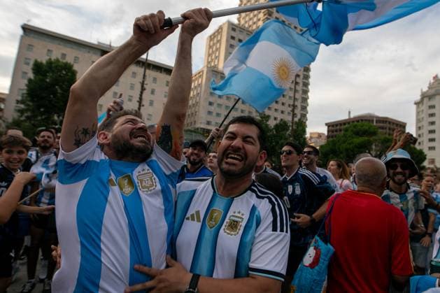 July 18, 2026, Madrid, Madrid, Spain: Two Argentine fans carry Argentine flags during a pre-match rally in Madrid.Argentine football fans gathered in Madrid s Plaza EspaoÂ±a to show their support for their team ahead of the 2026 FIFA World Cup, WM, Weltmeisterschaft, Fussball final against Spain in New York, USA. Argentine Fan Rally In Madrid  - ZUMAs197 0862030823st Copyright: xDavidxCanalesx