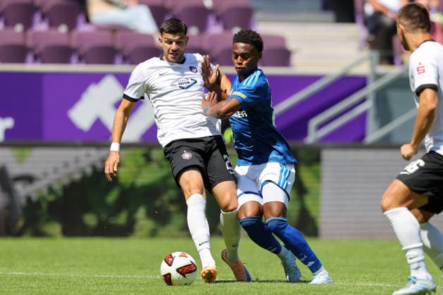 19.07.2026, xtgx, Fussball - Testspiel Erzgebirge Aue - FC Schalke 04 v.l. Stylianos Kokovas (Aue, 29), Junior Adamu (Schalke, 20) Zweikampf, Duell, Kampf, tackle (DFL DFB REGULATIONS PROHIBIT ANY USE OF PHOTOGRAPHS as IMAGE SEQUENCES and or QUASI-VIDEO) Aue *** July 19, 2026, xtgx, Soccer Friendly Match: Erzgebirge Aue vs. FC Schalke 04, by Stylianos Kokovas, Aue, 29, Junior Adamu (Schalke), 20, tackle, duel, battle, DFL and DFB regulations prohibit any use of photographs as image sequences and or quasi-video, Aue