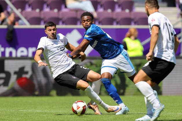 19.07.2026, xtgx, Fussball - Testspiel Erzgebirge Aue - FC Schalke 04 v.l. Stylianos Kokovas (Aue, 29), Junior Adamu (Schalke, 20) Zweikampf, Duell, Kampf, tackle (DFL DFB REGULATIONS PROHIBIT ANY USE OF PHOTOGRAPHS as IMAGE SEQUENCES and or QUASI-VIDEO) Aue *** July 19, 2026, xtgx, Soccer Friendly Match: Erzgebirge Aue vs. FC Schalke 04, by Stylianos Kokovas, Aue, 29, Junior Adamu (Schalke), 20, tackle, duel, battle, DFL and DFB regulations prohibit any use of photographs as image sequences and or quasi-video, Aue