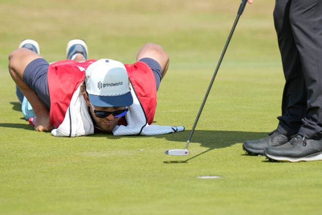 SOUTHPORT, ENGLAND - JULY 19: Kessler Karain, caddie to Patrick Reed (USA) lines up his putt on the 3rd green during Round 4 of the 154th Open Championship at the Royal Birkdale Golf Club, Southport on July 19, 2026 in Merseyside, England The 154th British Open Championship