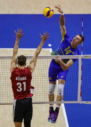WomenÕs Volleyball Nations League - Belgrade 2026 Ukraine s Illa Kovalov spikes the ball against Germany s Yann Bohme during the MenÕs Volleyball Nations League Pool 7 match between Germany and Ukraine at Belgrade Arena on July 19, 2026 in Belgrade, Serbia. Belgrade Serbia Copyright: xSrdjanxStevanovicx x