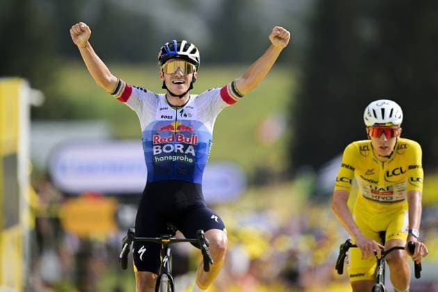 Belgian Remco Evenepoel of Red Bull-BORA-hansgrohe celebrates as he wins ahead of Slovenian Tadej Pogacar of UAE Team Emirates XRG stage 15 of the 2026 Tour de France cycling race, a stage of 184km from Champagnole to Plateau de Solaison, on Sunday 19 July 2026. The 113th edition of the Tour de France starts on Saturday 4 July in Barcelona, Spain, and will finish in Paris, France on the 26th of July. DAVIDxPINTENS  x181485583x