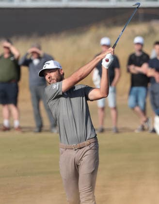 American sam Burns hits a fairway iron on the 16th hole at the 154th Open Championship at Royal Birkdale in Southport, on Sunday, July 19, 2026. Cox won the tournament with a score of ten under par.  LON2026071928 HUGOxPHILPOTT