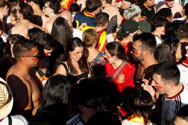 July 19, 2026, Madrid, Madrid, Spain: Thousands of Spanish soccer fans gather at the Puente del Rey esplanade to watch the highly anticipated 2026 World Cup Final match being played between Spain and Argentina on a giant screen installed by the Madrid City Council. The enthusiastic supporters braved the intense summer heat of the capital, arriving with hats, their faces painted in the national colors, and waving flags to passionately cheer for the Spanish national team, Nationalteam As the historic championship clash between the European and South American powerhouses unfolded, the atmosphere in the Madrid Rio park transformed into a tense and vibrant sea of red and yellow. The devoted crowd experienced every crucial play, foul, and shot on goal with overwhelming collective emotion and anxiety, dreaming of lifting the coveted trophy. Madrid Spain - ZUMAo127 20260719_zep_o127_027 Copyright: xHugoxOrtunox