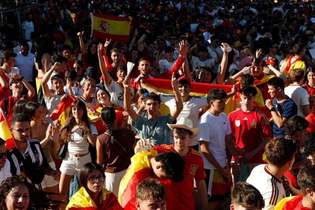 July 19, 2026, Madrid, Madrid, Spain: Thousands of Spanish soccer fans gather at the Puente del Rey esplanade to watch the highly anticipated 2026 World Cup Final match being played between Spain and Argentina on a giant screen installed by the Madrid City Council. The enthusiastic supporters braved the intense summer heat of the capital, arriving with hats, their faces painted in the national colors, and waving flags to passionately cheer for the Spanish national team, Nationalteam As the historic championship clash between the European and South American powerhouses unfolded, the atmosphere in the Madrid Rio park transformed into a tense and vibrant sea of red and yellow. The devoted crowd experienced every crucial play, foul, and shot on goal with overwhelming collective emotion and anxiety, dreaming of lifting the coveted trophy. Madrid Spain - ZUMAo127 20260719_zep_o127_029 Copyright: xHugoxOrtunox