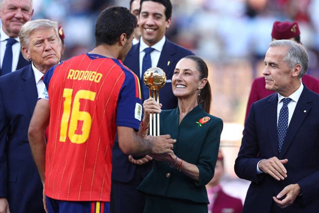 New Jersey, USA, 19th July 2026. Rodri of Spain is presented the Golden ball trophy for best player of the tournament by Claudia Sheinbaum, president of Mexico during the Spain vs Argentina FIFA World Cup, WM, Weltmeisterschaft, Fussball final match at the Metlife Stadium, New Jersey. Picture credit should read: Paul Terry Sportimage EDITORIAL USE ONLY. No use with unauthorised audio, video, data, fixture lists, club league logos or live services. Online in-match use limited to 120 images, no video emulation. No use in betting, games or single club league player publications. SPI_166_PT_Spain_Argentina SPI-4862-0166