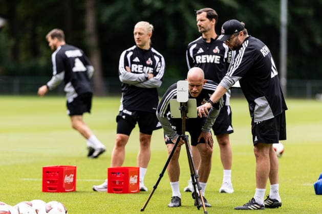 COLOGNE, GERMANY - JULY 20: Rene Wagner (Head Coach 1. FC Koeln) and Tillmann Bockhorst (Athletics Coach 1. FC Koeln) looking at scouting data during a training session of season 2026 27 at Geissbockheim on July 20, 2026 in Cologne, Germany. North Rhine Westphalia Germany Copyright: xSteffiexWunderlx