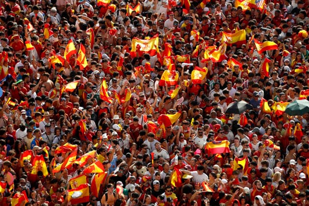 July 20, 2026, Madrid, Madrid, Spain: Aerial view from the observation deck of the Palacio de Cibeles as a massive, euphoric crowd of Spanish soccer fans fills the iconic Plaza de Cibeles hours before the arrival of the national team, Nationalteam to celebrate their 2026 World Cup 1-0 victory over Argentina. Local authorities and the Government Delegation reported a historic turnout of up to two million people across the streets of Madrid, with around 120,000 supporters packing the square itself. Creating a fiercely festive atmosphere, the sea of fans arrived in red and yellow jerseys, enthusiastically waving flags, holding up scarves, and chanting endlessly to secure the best vantage points to welcome La Roja and commemorate the conquest of their much-anticipated second star. Madrid Spain - ZUMAo127 20260720_zep_o127_180 Copyright: xHugoxOrtunox