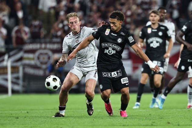 SOCCER - UEFA CL, Sturm vs Hearts GRAZ,AUSTRIA,21.JUL.26 - SOCCER - UEFA Champions League, qualification, SK Sturm Graz vs Heart of Midlothian FC. Image shows Calvin Miller (Hearts) and Jacob Hoedl (Sturm).  GEPAxpictures xChrisxBauer
