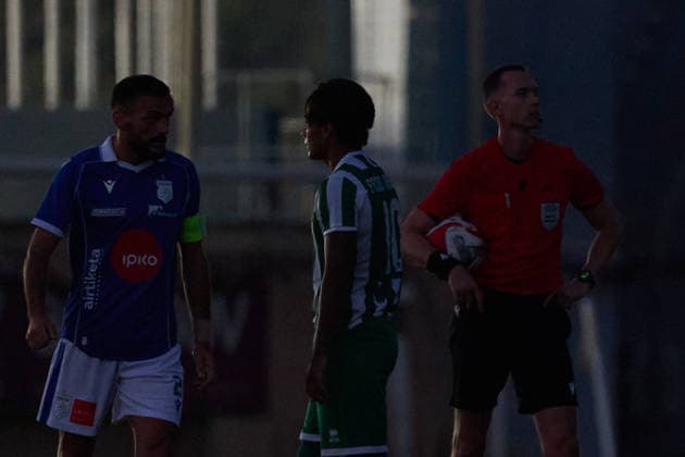 UEFA appointed match referee Marius Hansen Grotta (right) looks on amid a power outage during the UEFA Conference League Second qualifying round, 1st Leg match between Floriana and Drita at Centenary Stadium, Ta Qali, Malta on 21 July, 2026. Floriana v Drita - UEFA Conference League Second Qualifying Round 1st Leg