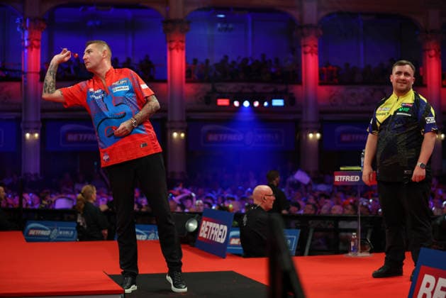 RECORD DATE NOT STATED 21st July 2026, Winter Gardens, Blackpool, Lancashire, England; 2026 Betfred World Matchplay Darts, Day Four; Nathan Aspinall takes out 170 as Luke Littler looks on smiling AidanxHunter