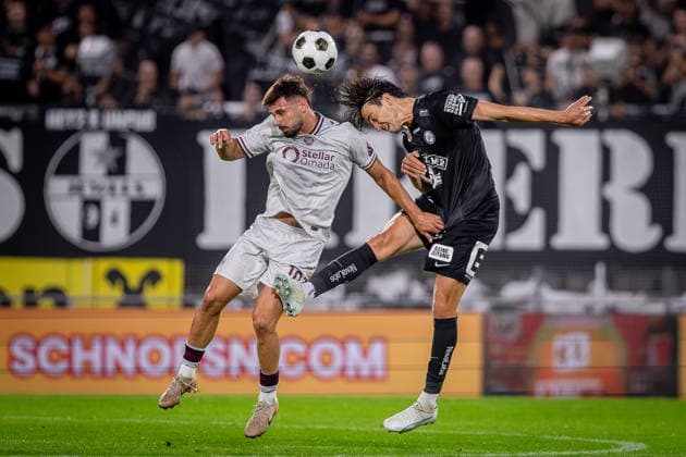 STURM GRAZ - HEARTS Albert Vallci of Sturm and Claudio Braga of Hearts during the first leg of second qualifying round of UEFA Champions League football match between Sturm Graz and Heart of Midlothian FC at the Merkur Arena (Stadion Graz Liebenau). Graz, Austria, July 21, 2026. Photo by Branislav Racko Copyright: xx 080A1663