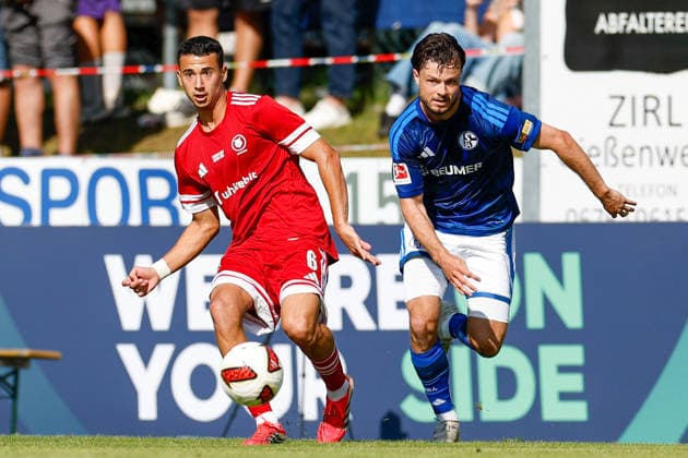 SOCCER - Schalke vs Kharkiv, test match KEMATEN,AUSTRIA,22.JUL.26 - SOCCER - 1. DFL, 1. Deutsche Bundesliga, Premjer-Liha, FC Schalke 04 vs FC Kharkiv, test match. Image shows Rafae lProfini (Kharkiv) and Adrian Gantenbein (Schalke).  GEPAxpictures xMarkoxVulic