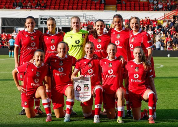Wrexham, Wales, 22nd July 2026. The players of Wrexham pose for a team photo ahead of the Pyunik v Wrexham Women UEFA Womens Champions League Qualifying match at The Racecourse, Wrexham. Picture credit should read: Cody Froggatt Sportimage EDITORIAL USE ONLY. No use with unauthorised audio, video, data, fixture lists, club league logos or live services. Online in-match use limited to 120 images, no video emulation. No use in betting, games or single club league player publications. SPI_005_CF_PYUNIK_V_WREXHAM_WOMEN SPI-4881-0005