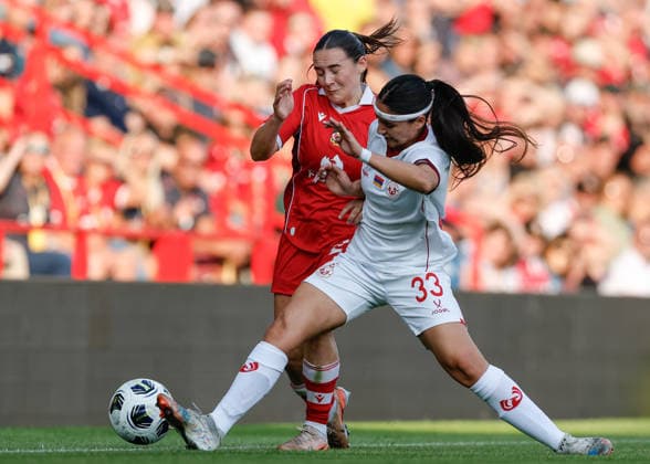 Wrexham, Wales, 22nd July 2026. Carla Daniela Scanio Puebla of Pyunik tackles MariaFrancis-Jones of Wrexham during the Pyunik v Wrexham Women UEFA Womens Champions League Qualifying match at The Racecourse, Wrexham. Picture credit should read: Cody Froggatt Sportimage EDITORIAL USE ONLY. No use with unauthorised audio, video, data, fixture lists, club league logos or live services. Online in-match use limited to 120 images, no video emulation. No use in betting, games or single club league player publications. SPI_015_CF_PYUNIK_V_WREXHAM_WOMEN SPI-4881-0015