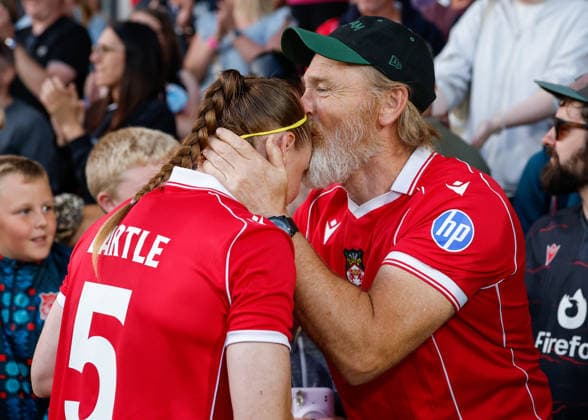 Wrexham, Wales, 22nd July 2026. Jodie Bartle of Wrexham celebrates the full time result with her family and friends following the Pyunik v Wrexham Women UEFA Womens Champions League Qualifying match at The Racecourse, Wrexham. Picture credit should read: Cody Froggatt Sportimage EDITORIAL USE ONLY. No use with unauthorised audio, video, data, fixture lists, club league logos or live services. Online in-match use limited to 120 images, no video emulation. No use in betting, games or single club league player publications. SPI_032_CF_PYUNIK_V_WREXHAM_WOMEN SPI-4881-0032