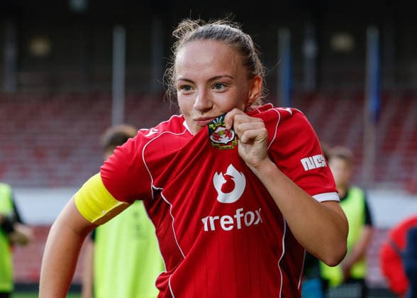 Wrexham, Wales, 22nd July 2026. Lili Jones of Wrexham celebrates the full time result following the Pyunik v Wrexham Women UEFA Womens Champions League Qualifying match at The Racecourse, Wrexham. Picture credit should read: Cody Froggatt Sportimage EDITORIAL USE ONLY. No use with unauthorised audio, video, data, fixture lists, club league logos or live services. Online in-match use limited to 120 images, no video emulation. No use in betting, games or single club league player publications. SPI_033_CF_PYUNIK_V_WREXHAM_WOMEN SPI-4881-0033
