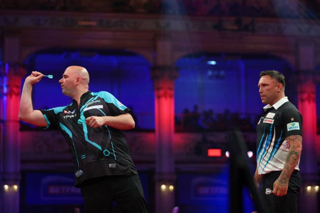 RECORD DATE NOT STATED 22nd July 2026, Winter Gardens, Blackpool, Lancashire, England; 2026 Betfred World Matchplay Darts, Day Five; Rob Cross in action at the oche as Gerwyn Price looks on AidanxHunter