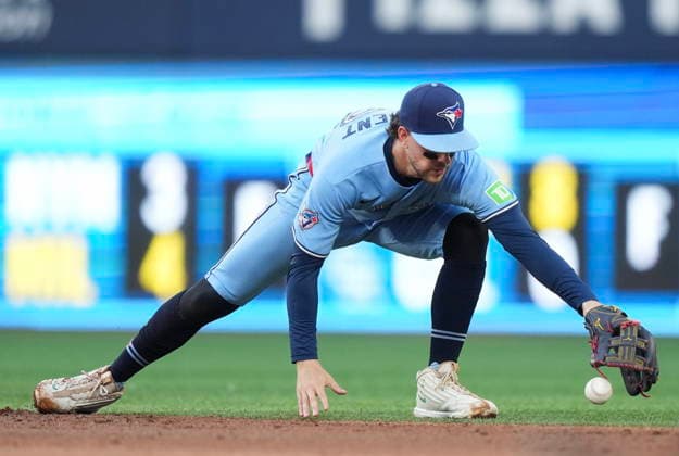 July 22, 2026, Toronto, On, CANADA: Toronto Blue Jays second baseman Ernie Clement (22) knocks down a ball hit by the Tampa Bay Rays and makes the out at first base during third inning MLB, Baseball Herren, USA baseball action in Toronto on Wednesday, July 22, 2026. Canada News - July 22, 2026  - ZUMAc35_ 20260722_zaf_c35_120 Copyright: xNathanxDenettex