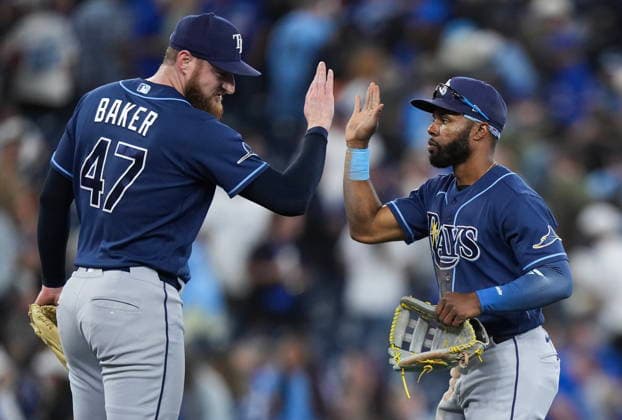 July 22, 2026, Toronto, On, CANADA: Tampa Bay Rays outfielder Cedric Mullins, right, celebrates with Bryan Baker (47) after defeating the Toronto Blue Jays in MLB, Baseball Herren, USA baseball action in Toronto on Wednesday, July 22, 2026. Canada News - July 22, 2026  - ZUMAc35_ 20260722_zaf_c35_126 Copyright: xNathanxDenettex