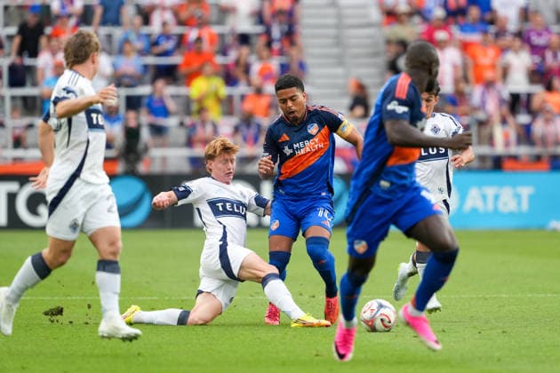 July 22, 2026, Cincinnati, Ohio, USA: Vancouver Whitecaps midfielder Oliver Larraz (8) dives in wining the ball from FC Cincinnati midfield Evander da Silva Ferreira (10) preventing an attacking opportunity during an MLS, Fussball Herren, USA game at TQL Stadium Soccer 2026:FC Cincinnati V Vancouver Whitecaps  - ZUMAt168 20260722_zsp_t168_031 Copyright: xTrentxPattersonx