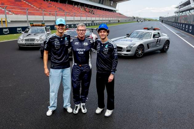 BUDAPEST - Formula 1 driver Kimi Antonelli of Mercedes AMG-Petronas Formula One Team, Safety Car driver Bernd Maylander, Formula 1 driver George Russell of Mercedes AMG-Petronas Formula One Team during the Formula 1 Hungary at the Hungaroring circuit on July 23, 2026 in Budapest, Hungary. (Photo by DeFodi Images) - *** BUDAPEST: Formula 1 driver Kimi Antonelli of the Mercedes AMG Petronas Formula One Team, safety car driver Bernd Maylander, and Formula 1 driver George Russell of the Mercedes AMG Petronas Formula One Team during the Formula 1 Hungarian Grand Prix at the Hungaroring circuit on July 23, 2026 in Budapest, Hungary. Photo by DeFodi Images