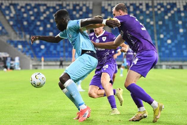Gent s Wilfried Kanga and Cherkasy s Nazarii Muravskyi pictured in action during a soccer game between Ukrainian FC LNZ Cherkasy and Belgian KAA Gent, Thursday 23 July 2026 in Plock, Poland, the first leg of the second qualifying round for the UEFA Conference League. JILLxDELSAUX  x181871656x