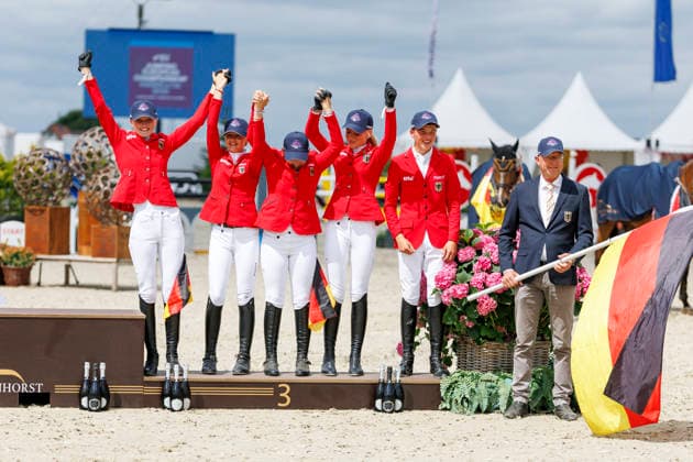 HAGEN a.T.W. - FEI Jumping European Championship, EM, Europameisterschaft Children, Juniors and Young Rider 2026, HAGEN a.T.W. - FEI Jumping European Championship Children, Juniors and Young Rider 2026 Team Germany KUEHNER Grace Isabelle (GER), OSING Mila (GER), THOMSEN Justus (GER), BROCKS Luisa Charlotte (GER), SPREHE Joelle (GER), (SEEMANN Eberhard) Championship ceremony Team Final Nations Cup CH-EU-Ch-S - Children 2nd COMPETITION Teams & Individuals over two rounds - SECOND ROUND Hagen a.T.W., Reitanlage Haunhorst 24. July 2026 - *** HAGEN a T W FEI Jumping European Championship for Children, Juniors, and Young Riders 2026, HAGEN a T W FEI Jumping European Championship for Children, Juniors, and Young Riders 2026 Team Germany KUEHNER Grace Isabelle GER, OSING Mila GER, THOMSEN Justus GER, BROCKS Luisa Charlotte GER, SPREHE Joelle GER, SEEMANN Eberhard Championship Ceremony Team Final Nations Cup CH EU Ch S Children 2nd COMPETITION Teams Individuals over two rounds SECOND ROUND Hagen a T W, Haunhorst Equestrian Center, July 24, 2026