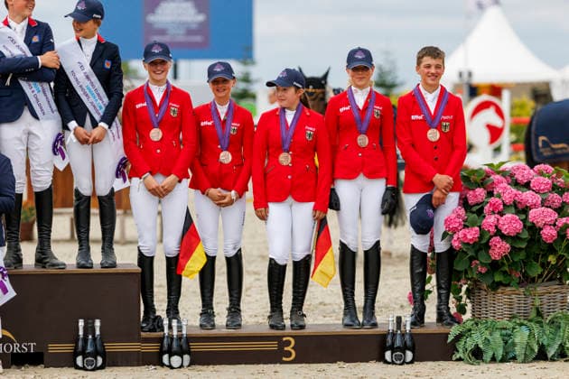 HAGEN a.T.W. - FEI Jumping European Championship, EM, Europameisterschaft Children, Juniors and Young Rider 2026, HAGEN a.T.W. - FEI Jumping European Championship Children, Juniors and Young Rider 2026 Team Germany KUEHNER Grace Isabelle (GER), OSING Mila (GER), THOMSEN Justus (GER), BROCKS Luisa Charlotte (GER), SPREHE Joelle (GER), (SEEMANN Eberhard) Championship ceremony Team Final Nations Cup CH-EU-Ch-S - Children 2nd COMPETITION Teams & Individuals over two rounds - SECOND ROUND Hagen a.T.W., Reitanlage Haunhorst 24. July 2026 - *** HAGEN a T W FEI Jumping European Championship for Children, Juniors, and Young Riders 2026, HAGEN a T W FEI Jumping European Championship for Children, Juniors, and Young Riders 2026 Team Germany KUEHNER Grace Isabelle GER, OSING Mila GER, THOMSEN Justus GER, BROCKS Luisa Charlotte GER, SPREHE Joelle GER, SEEMANN Eberhard Championship Ceremony Team Final Nations Cup CH EU Ch S Children 2nd COMPETITION Teams Individuals over two rounds SECOND ROUND Hagen a T W, Haunhorst Equestrian Center, July 24, 2026