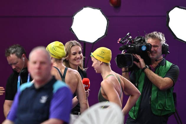 COM26 SWIMMING HEATS, Ariarne Titmus doing commentating duties for Channel 7 in the mixed zone during the swimming heats at the Glasgow 2026 Commonwealth Games at the Tollcross International Swimming Centre in Glasgow, Scotland, Friday, July 24, 2026. ( NO ARCHIVING, EDITORIAL USE ONLY Glasgow Scotland United Kingdom  Copyright: xDEANxLEWINSx 20260724133702858467