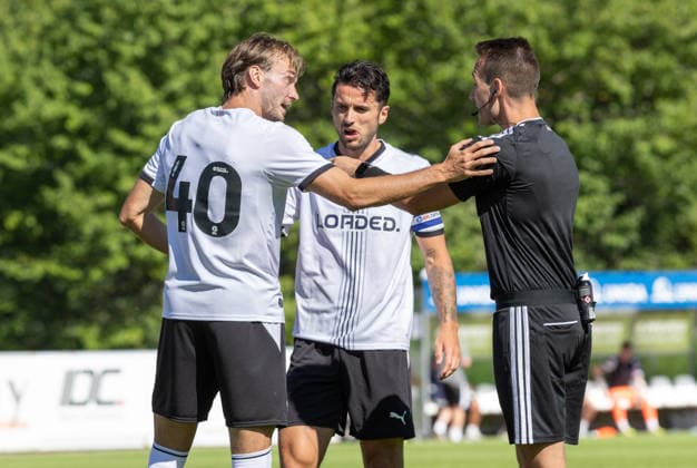 SOCCER - Freiburg vs Derby, test match IMST,AUSTRIA,24.JUL.26 - SOCCER - 1. DFL, 1. Deutsche Bundesliga, EFL Championship, SC Freiburg vs Derby County FC, test match. Image shows Ryan Hedges (Derby County) and referee Matthias Gaechter.  GEPAxpictures xMichaelxKristen