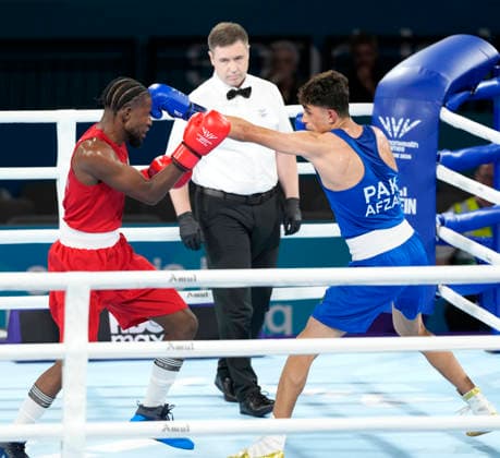 Commonwealth Games Day One Jovanie Bouzin (Red) and Afzal Khan take part in the Mens 65kg Boxing - Prelims during Day One of the 2026 Commonwealth Games at the SEC Centre in Glasgow, Scotland 24 07 2026 UK Newspapers OUT Copyright: xGrahamxGlendinningx FIL-23650-0029